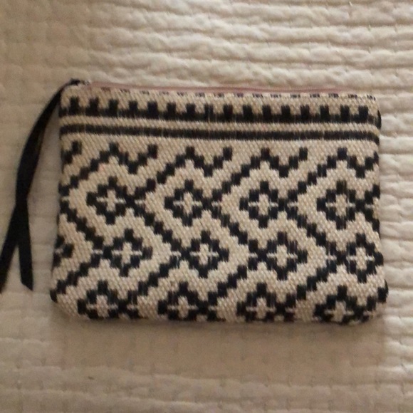 Mango clutch. Textured geometric pattern. Zip top w/ black grosgrain ribbon pull - Picture 6 of 11